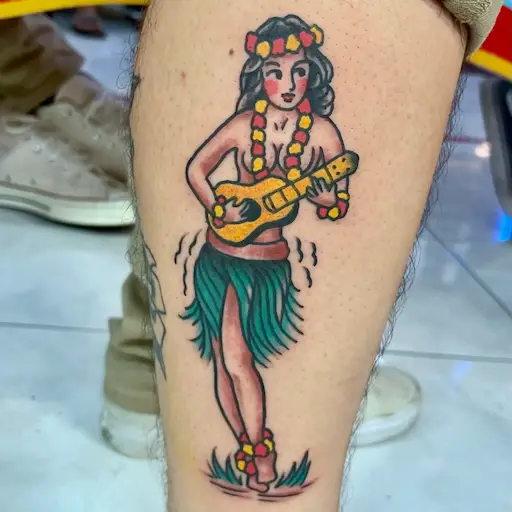 Classic American traditional hula girl tattoo with ukulele by Dustin Gormley in Waikiki Hawaii